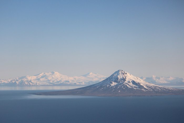 This active volcano forms an island in the western part of Cook Inlet.