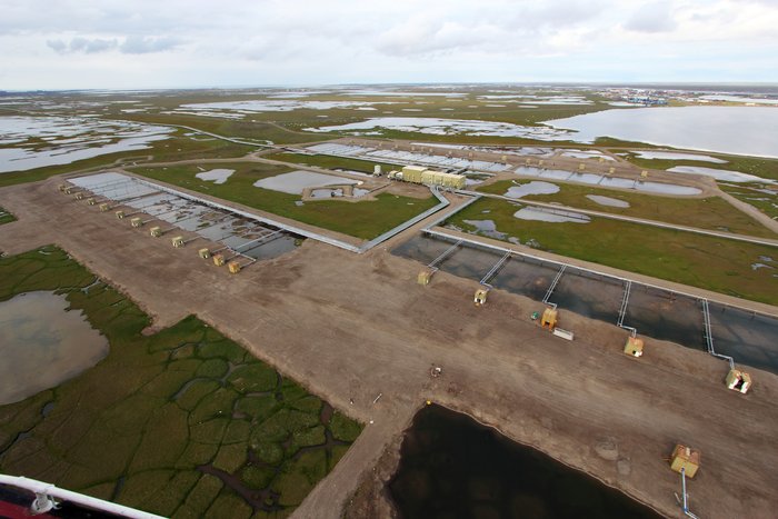 This large gravel pad is designed to insulate underlying permafrost, hopefully preventing melting that destroyed many early roads and pads.
