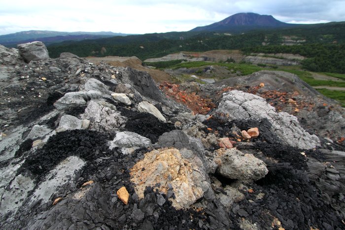 Sediment overlying coal seams is scraped off and dumped in piles to allow mining of coal at Gold Run Pass mine by <a href="http://www.groundtruthtrekking.org/Issues/AlaskaCoal/UsibelliCoalMine.html">Usibelli</a> in Alaska.