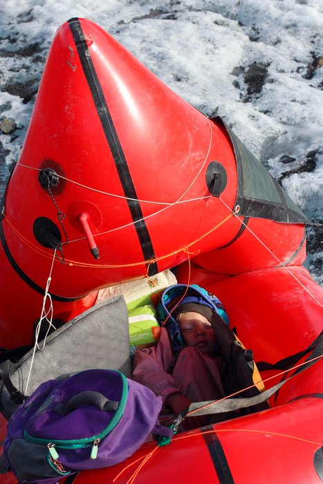 A small wheel made it possible to assemble a strange rickshaw out of our packraft and some local willow.  It provided a great ride for Katmai, and a place to set up the solar panel.  But it wasn't easy to cross bouldery terrain with this in tow.