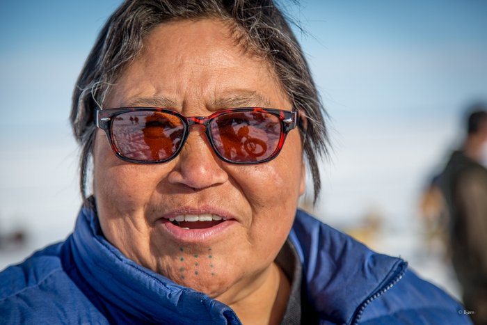  Aucha Kameroff joins in the festivities of the dog sled race. 