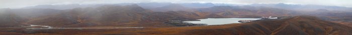Panorama showing the Red Dog airport, tailings pond, and associated facilities.  The mine itself is hidden behind the hill at right.