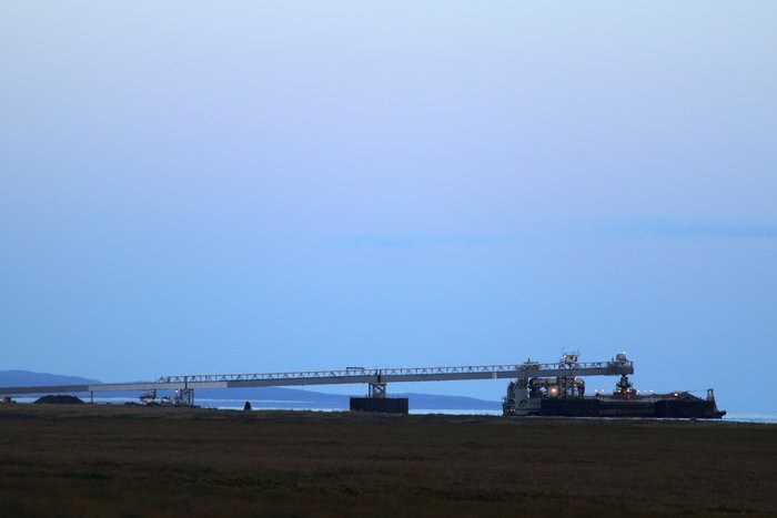 A barge loads at Red Dog's shallow water port.