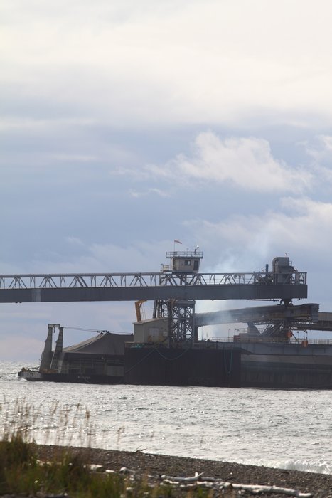 A barge loads at Red Dog's shallow water port.
