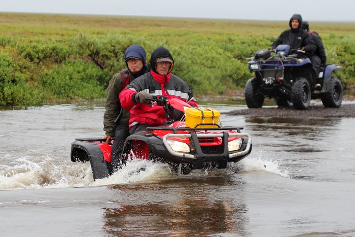 After crashing in a helicopter, we were rescued by residents of Pt. Hope on 4-wheelers.  The rivers were in high flood, adding atop other challenges in the rescue.