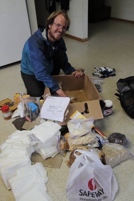 Unpacking a box of supplies in Kivalina.  Lots of food, lots of diapers, and a few bits and pieces besides.