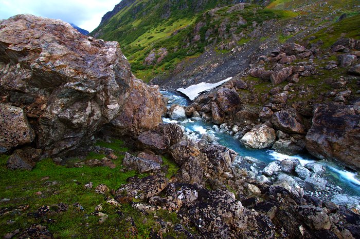 Boulders from an ancient landslide tower over this small river, even bridging it in one place.