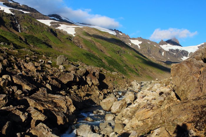 An ancient rock-fall dropped a mass of giant boulders, which were cut through by the upper reaches of the Tutka River.