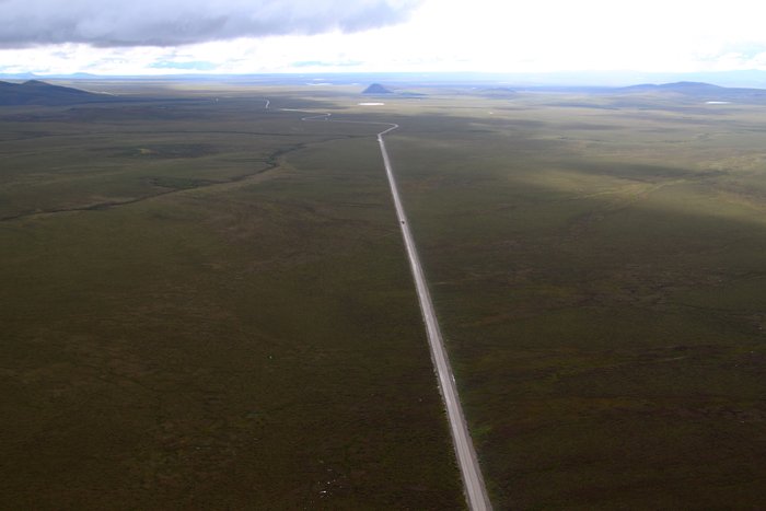 A truck full of zinc concentrate cruises down the Red Dog road.