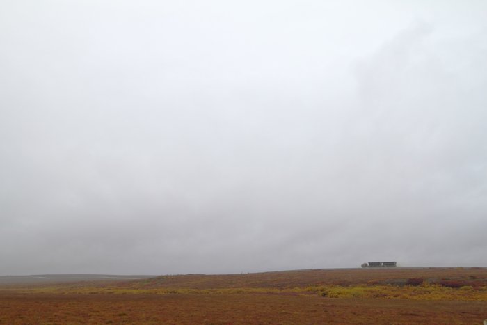 A truck full of zinc concentrate cruises down the Red Dog road.