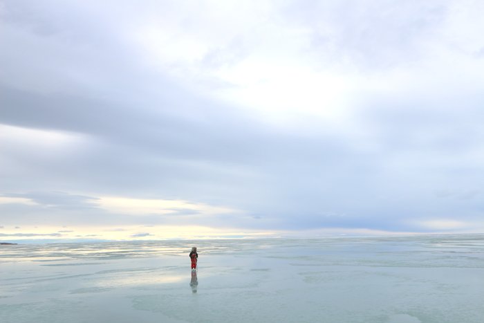 A thin sheen of water on ice sped up our skis, and reflected the sky above us