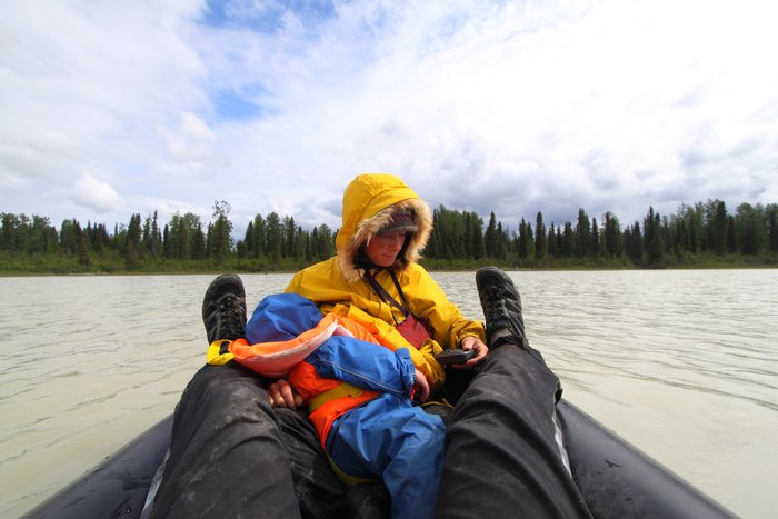 Katmai grabs a nursing snack in the packraft.