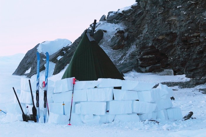 tent behind a snow block wall