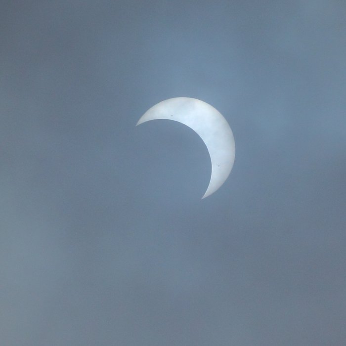 Clouds allowed us to see the sun directly, a glimpse of eclipse before grey covered it up again.