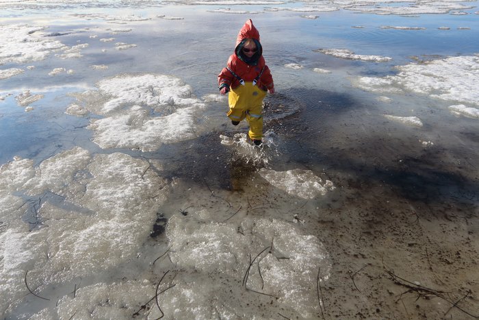 Running through the spring ice puddles