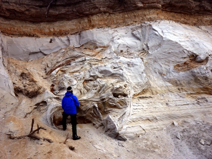 Caleb inspects potential evidence of seismic activity in the bluffs on the north shore of Lake Iliamna