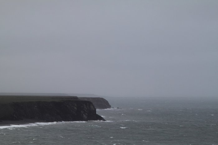 Hard wind drives waves against cliffs on the Chukchi Sea.
