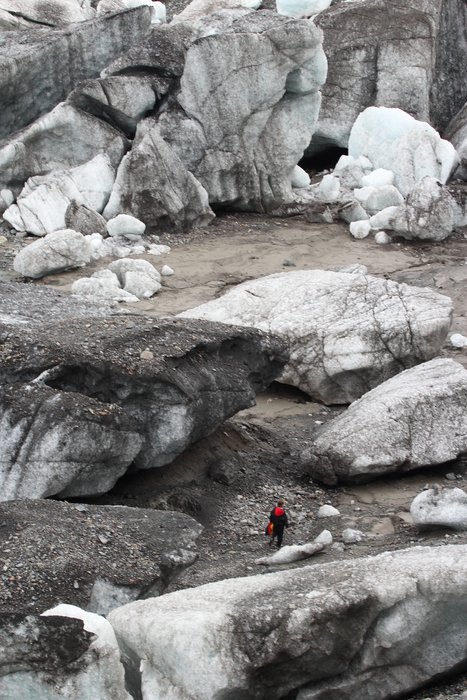Like an ant amongst ice cubes, Erin threads her way through stranded icebergs littered by Oily Lake.