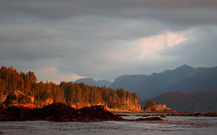 Sunset turns the shores of Coal Cove, near the village of Port Graham, a brilliant crimson.
