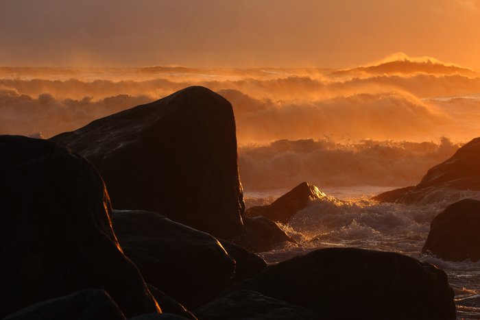 Diminishing waves in the waning of the day.