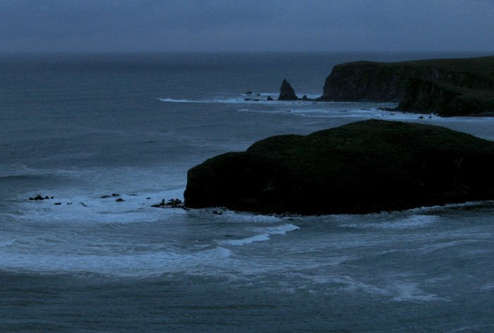 Waves crash against the exposed shore of Refuge Rock in Partition Cove.