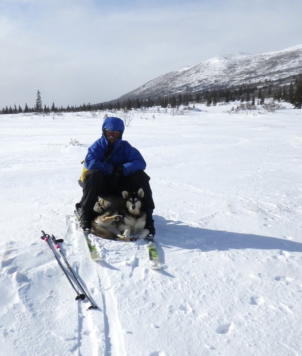 Caleb and Russell the Dog take a rest near Big Mountain above Lake Iliamna