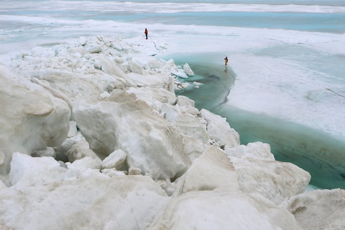 Checking out melt pools around one of Spring's last ice piles