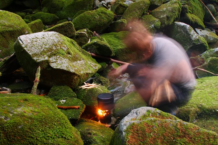 Most of the time we cook on fires, but when we were traveling through BC in the summer, we used a titanium woodstove to cook without a larger fire. 