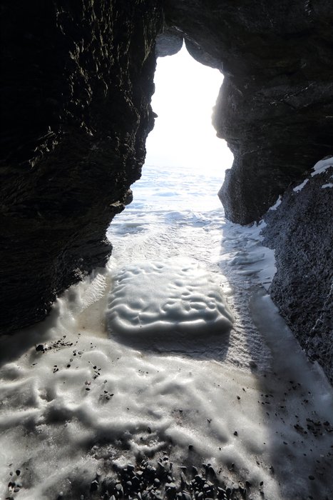 We camped in a sea arch during a big blow, and this was one of our two views out.