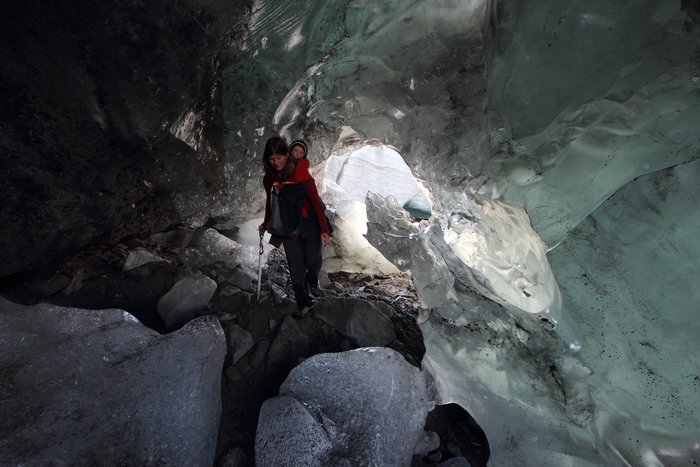 This stranded iceberg melted into a tunnel, where baby Lituya explores icebergs from mom's back on the edge of Malaspina Glacier