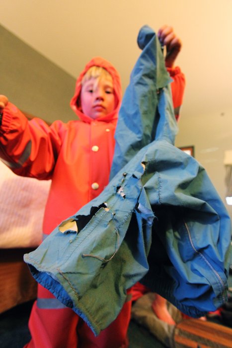 Katmai displays his shredded REI pants, while trying out a new suit of Grundens.