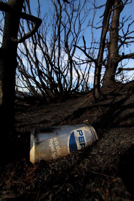 This can survived the fire, though the paint was damaged.  So it must not have exceeded 1220 F (660 C), the melting point of aluminum.