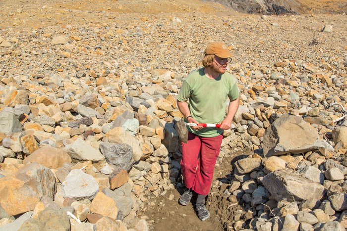 Hig digs a trench in the tsunami sediment directly across the fjord from the slide, on Hoof-Hill Fan.