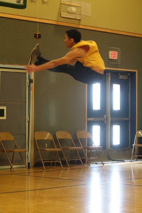An Alaska Native Youth Olympic event where the competitors leap up to kick a ball with both feet.