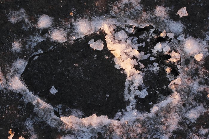 This bear print records the precise time when it was made by the character of the slush it imprints.  Hours after it fell as sleet, the slush froze, becoming brittle, but by morning when we found the track the ice was much harder and didn't capture the sharp edge of tracks.