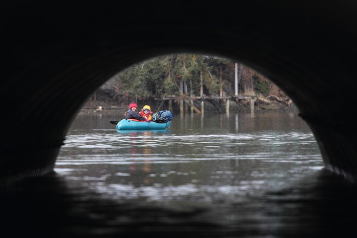 Hig paddled through the Fish Creek culvert with Katmai, snapping a photo of Erin and Lituya on the other side