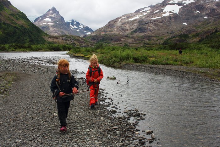 Lituya and Django hike along the river in upper Tutka Valley.
