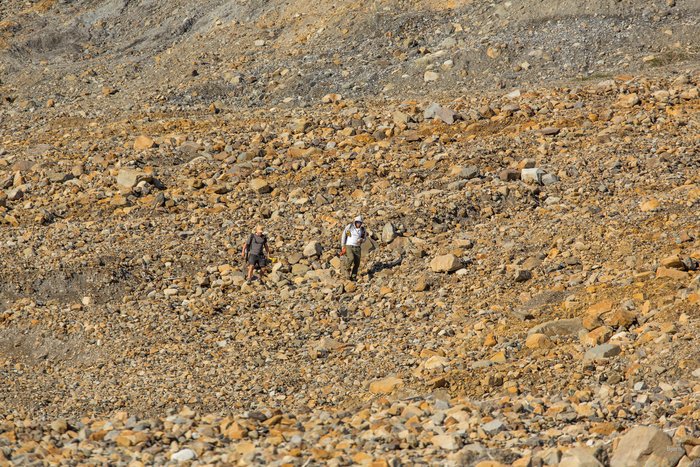 Andrew Mattox and Vasillios Skanavis make their way up Hoof-Hill Fan to survey the tsunami 'run-up' - high water mark.