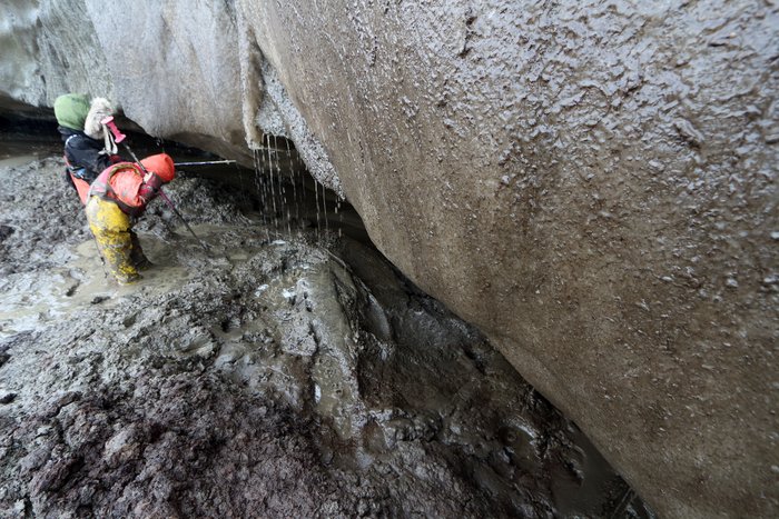 Spring weather brings warm weather to the Chukchi coast, sending water long frozen underground off this rapidly retreating permafrost cliff.