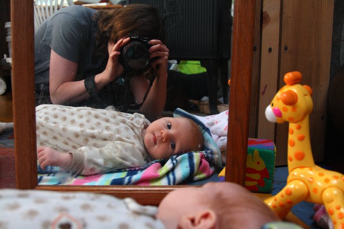 She won't look at the camera, but she will look at herself