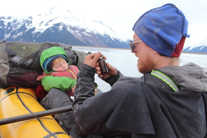Hig closes a sample bottle with water for a climate scientist in Boulder.