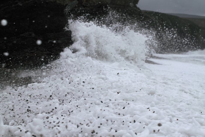 Waves constantly erode the beach.  Climate change accelerates this process, by raising sea level, increasing storms, and shrinking sea ice that armors the coast.