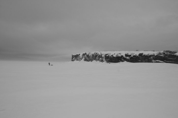 Kate battles the wind east of Iliamna village on Lake Iliamna
